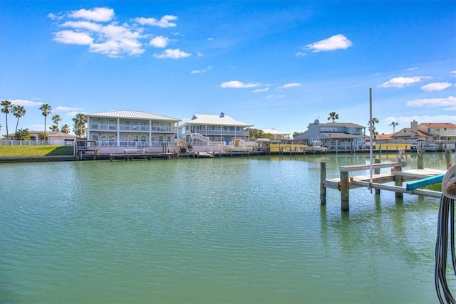 view of dock featuring a water view and a residential view