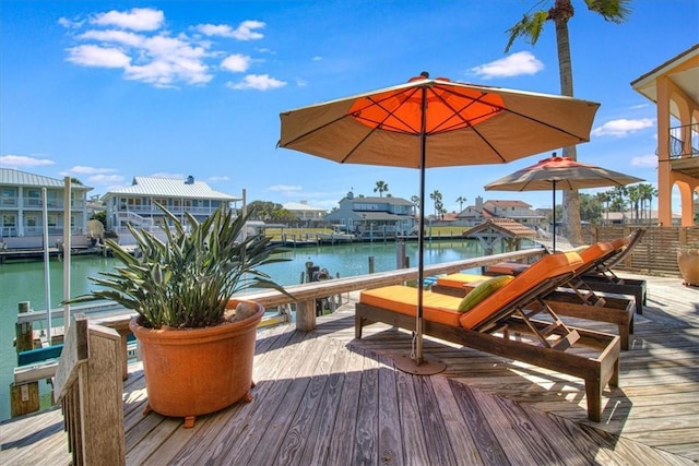 dock area with a water view and boat lift