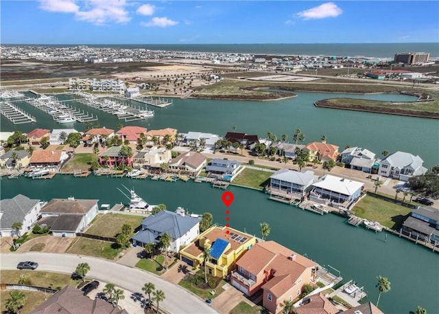 aerial view featuring a water view and a residential view