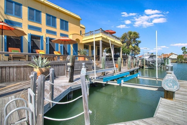 view of dock featuring a water view and boat lift