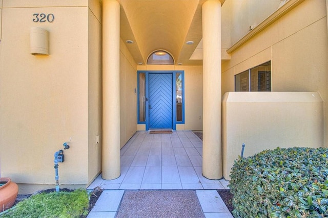 entrance to property with stucco siding