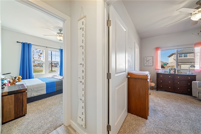 carpeted bedroom featuring ceiling fan