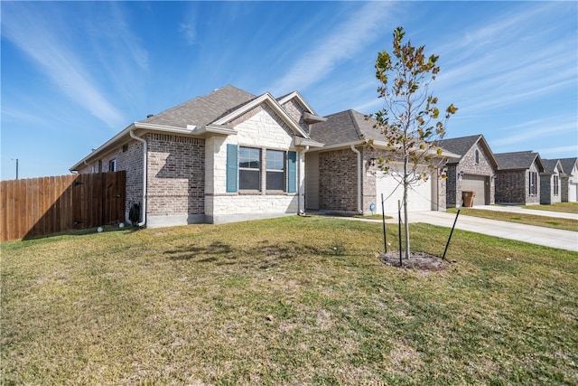 view of front of house with a garage and a front yard