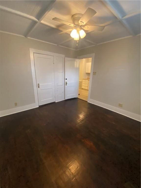 unfurnished bedroom with ceiling fan, dark hardwood / wood-style floors, and a closet