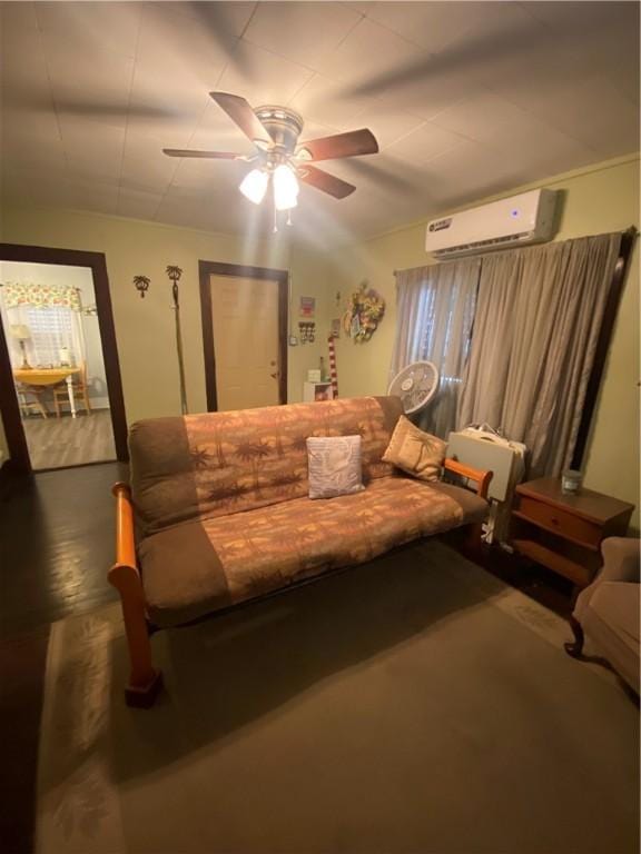 living room with ceiling fan and a wall mounted air conditioner