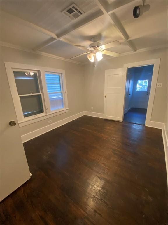 spare room with coffered ceiling, ceiling fan, ornamental molding, and dark hardwood / wood-style flooring