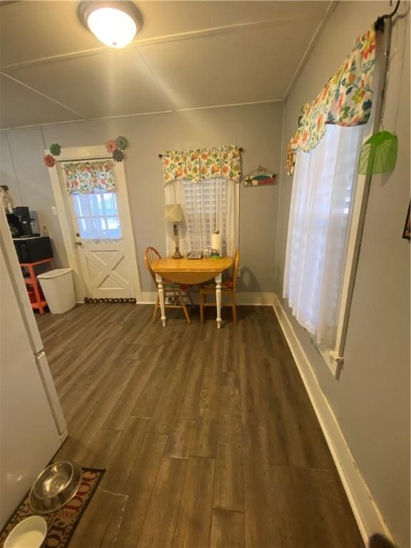 dining room with dark hardwood / wood-style floors