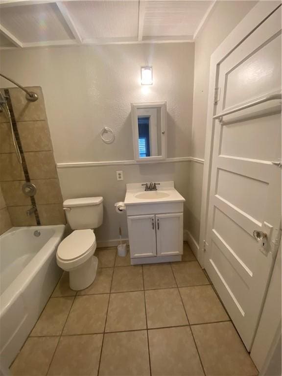 full bathroom with vanity, tile patterned flooring, tiled shower / bath combo, and toilet