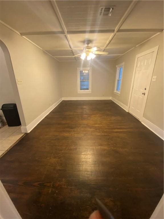 unfurnished room featuring ceiling fan and dark hardwood / wood-style floors