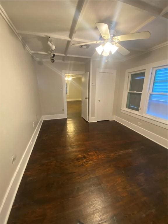 unfurnished room with dark wood-type flooring, ornamental molding, and ceiling fan