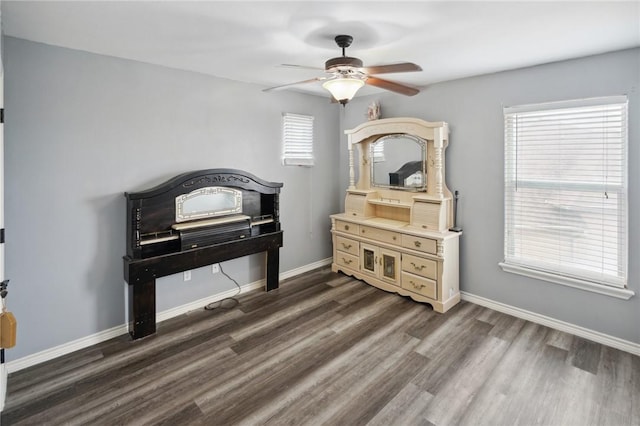 miscellaneous room featuring dark wood-type flooring and ceiling fan