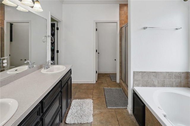 bathroom with vanity, tile patterned flooring, and shower with separate bathtub