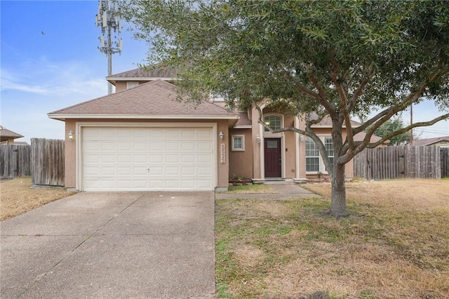 view of front of home featuring a garage and a front yard