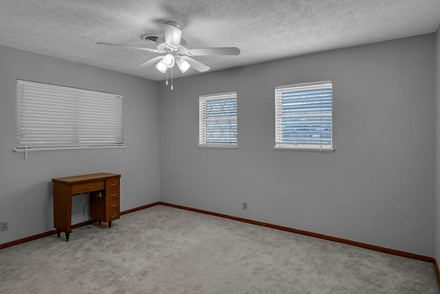 10630 Rockwood, Corpus Christi, TX 78410 - carpeted empty room with ceiling fan, baseboards, and a textured ceiling