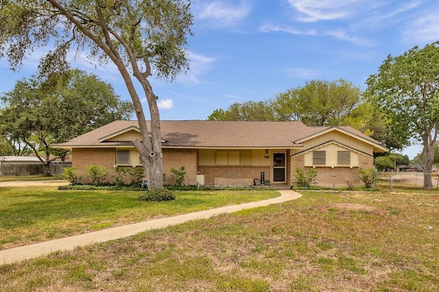 10630 Rockwood, Corpus Christi, TX 78410 - view of front of property with brick siding, a shingled roof, and board and batten siding