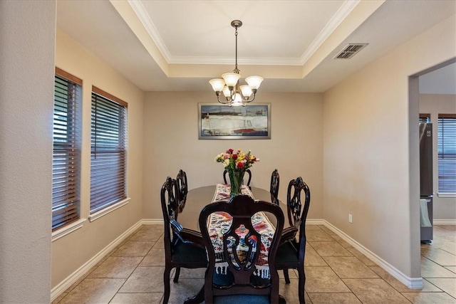 2618 Gentle Wind Ave, Corpus Christi, TX 78414 - dining room featuring light tile patterned flooring, a raised ceiling, a chandelier, and ornamental molding