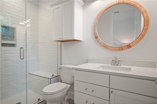 full bathroom featuring visible vents, a shower stall, toilet, and vanity