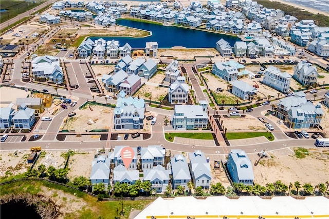 aerial view with a water view and a residential view