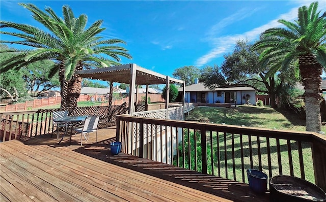 wooden terrace featuring a pergola and a yard