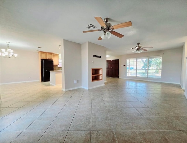unfurnished living room with light tile patterned floors, ceiling fan with notable chandelier, baseboards, and visible vents