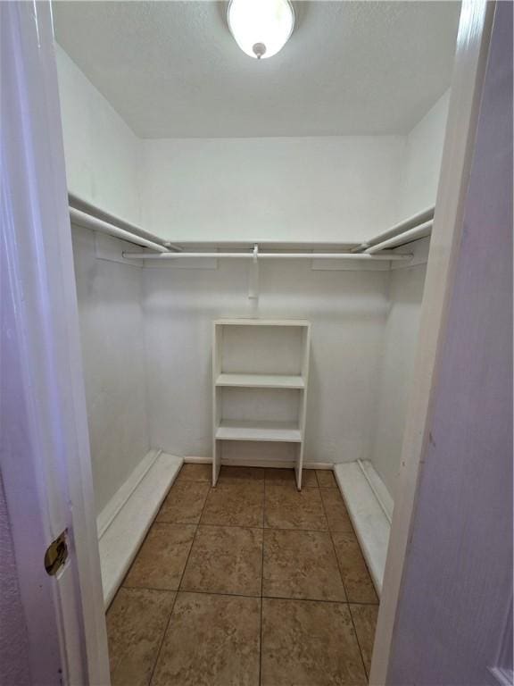 4109 Eagle Dr, Corpus Christi, TX 78413 - spacious closet featuring tile patterned floors