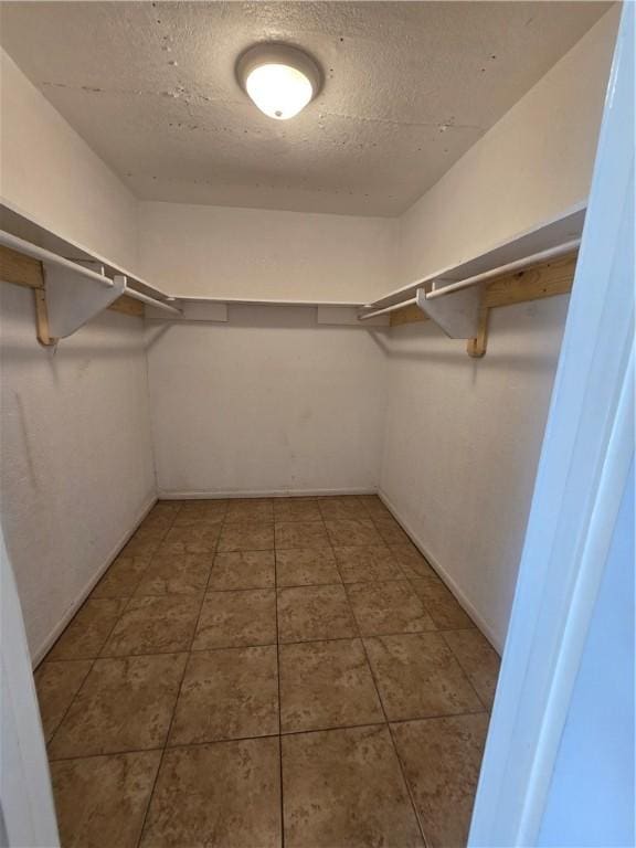 4109 Eagle Dr, Corpus Christi, TX 78413 - walk in closet with tile patterned flooring