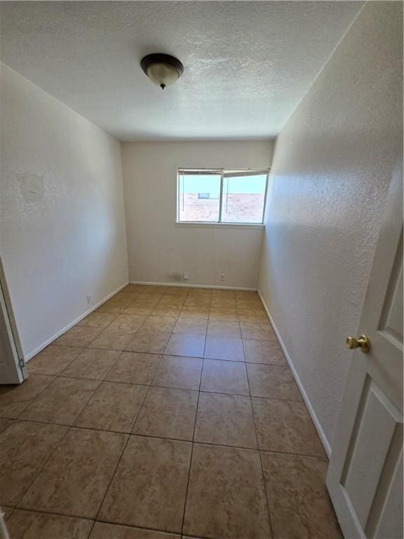 4109 Eagle Dr, Corpus Christi, TX 78413 - empty room with baseboards and tile patterned flooring