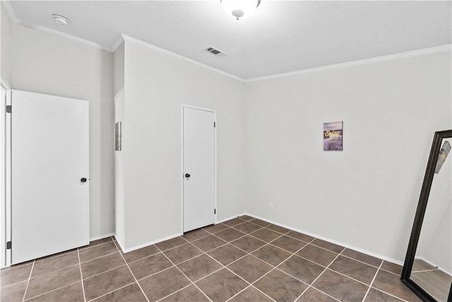 1182 Lee Rd, Aransas Pass, TX 78336 - laundry room with ornamental molding and dark tile patterned flooring