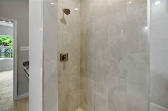 bathroom with tiled shower