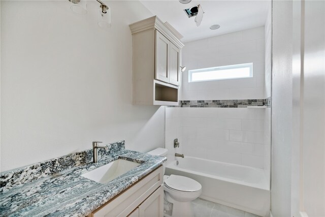 full bathroom featuring vanity, toilet, and tiled shower / bath