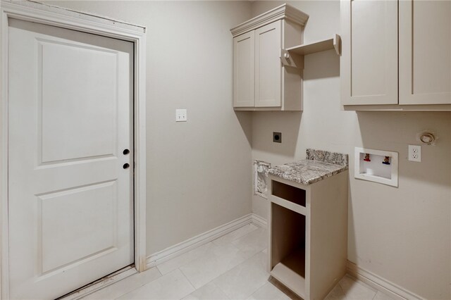 laundry room with cabinets, washer hookup, light tile patterned floors, and hookup for an electric dryer