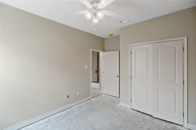 unfurnished bedroom with light colored carpet, ceiling fan, and a closet