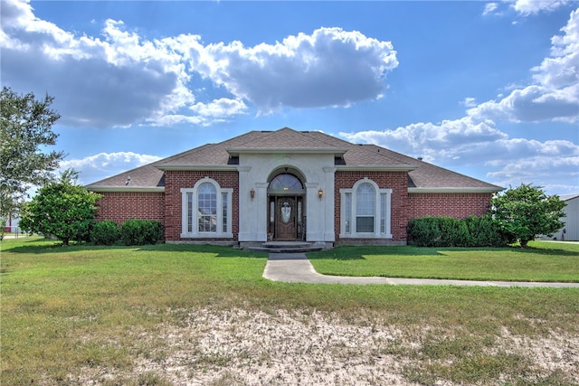 view of front of home with a front yard