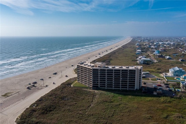 drone / aerial view featuring a water view and a view of the beach