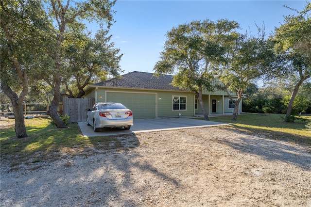 ranch-style house with a front lawn and a garage