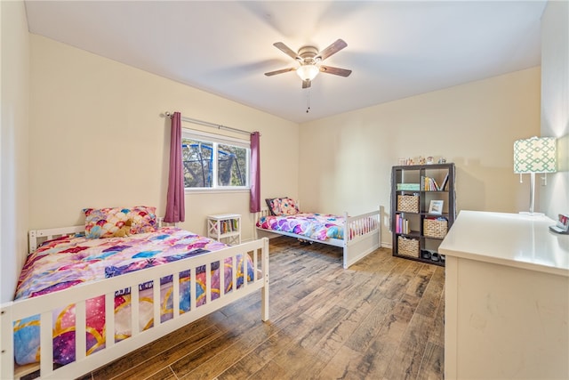 bedroom with ceiling fan and hardwood / wood-style floors