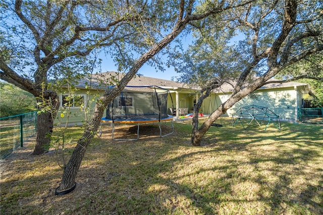 view of yard with a trampoline