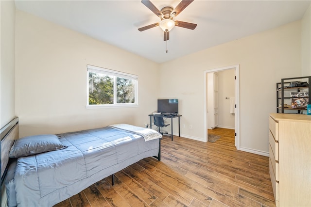 bedroom with ceiling fan and wood-type flooring