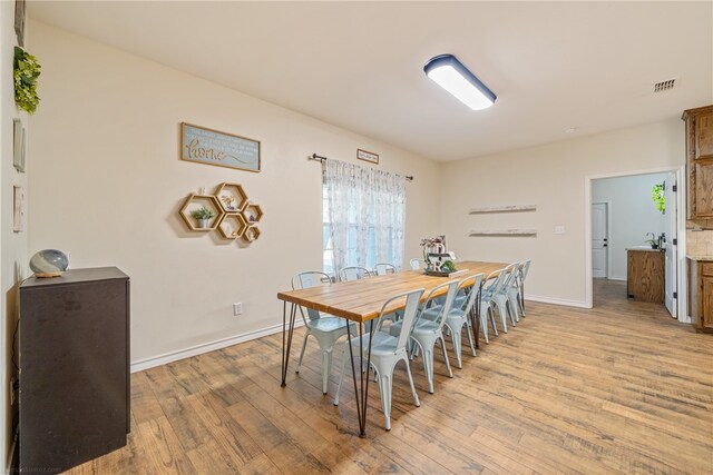 dining room with light hardwood / wood-style flooring