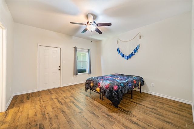 bedroom featuring hardwood / wood-style flooring and ceiling fan