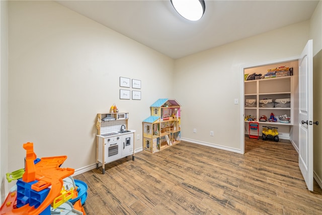 recreation room with hardwood / wood-style flooring