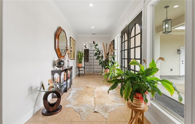 corridor featuring tile patterned floors, ornamental molding, baseboards, and recessed lighting