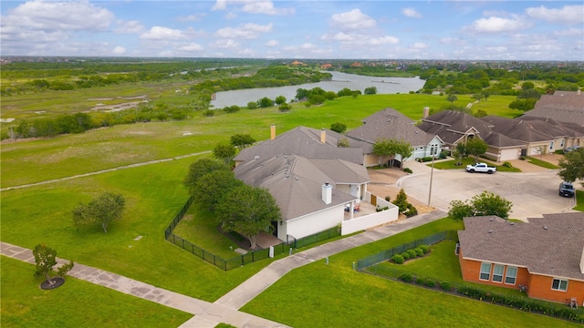 bird's eye view featuring a water view and a residential view