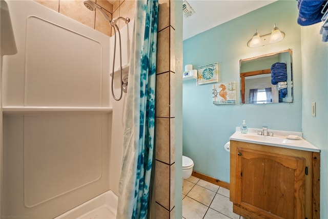 bathroom with walk in shower, toilet, vanity, and tile patterned floors