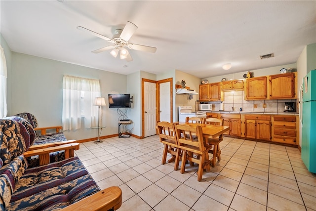 dining room featuring ceiling fan and light tile patterned floors