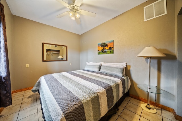 bedroom featuring ceiling fan and light tile patterned flooring