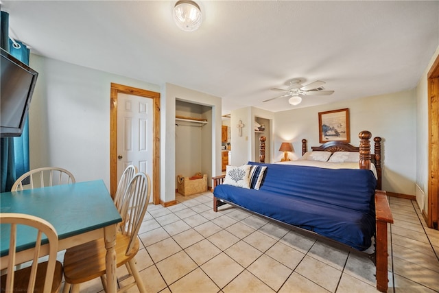 bedroom featuring light tile patterned floors and ceiling fan