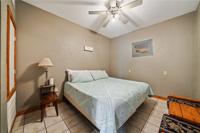 tiled bedroom with ceiling fan