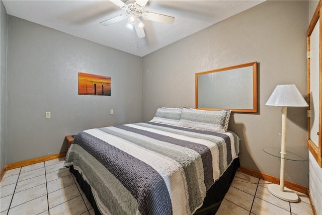 tiled bedroom with ceiling fan