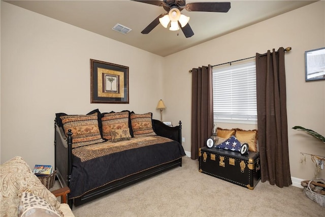 bedroom with light carpet and ceiling fan